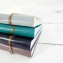 Colorful Leather Brag Book Albums - Metallic bronze wrap closure - by Blue Sky Papers